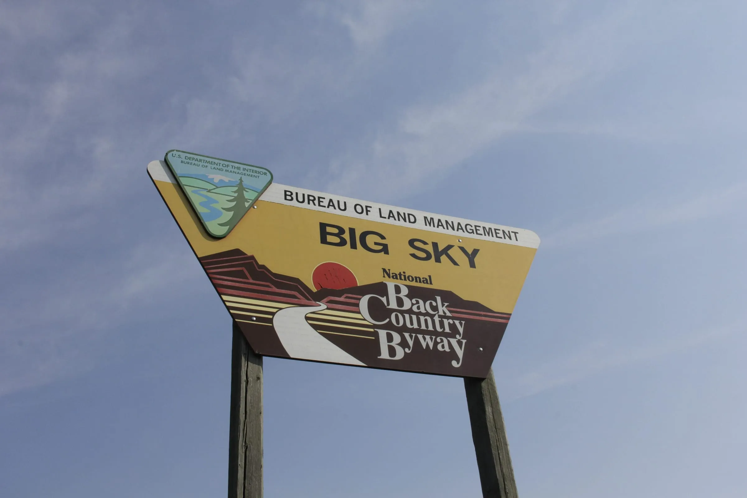 The Bureau of Land Management sign for the Big Sky Back Country Byway against a blue sky